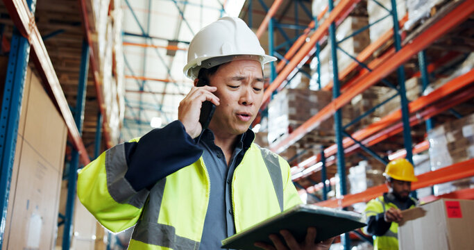Man, phone call and tablet at warehouse for shipping, contact or schedule for supply chain job. Person, tech and smartphone for logistics, low angle or talk with inventory management at storage plant