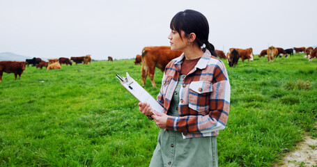 Woman, farm and inspection with clipboard for livestock, agriculture or economic production. Female person, farmer or cows with animals or checklist for agro business or development on farmland © ChasingMagic25/peopleimages.com