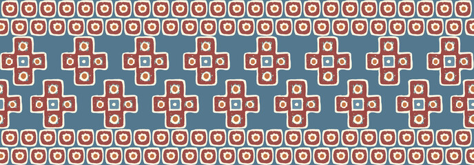 Seamless ethnic border strip with geometric crosses and dot tiles in terracotta and blue for apparel trim
