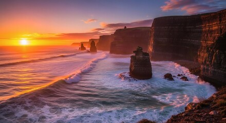Scenic golden sunset over rugged coastal cliffs, waves crashing along the shoreline