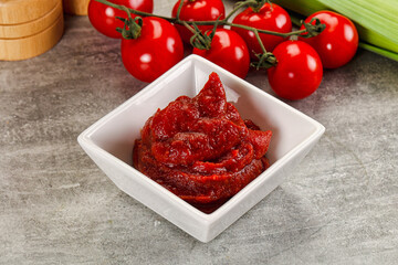 Red tomato paste in the bowl