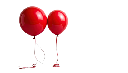 Two glossy red balloons stand against a stark black background
