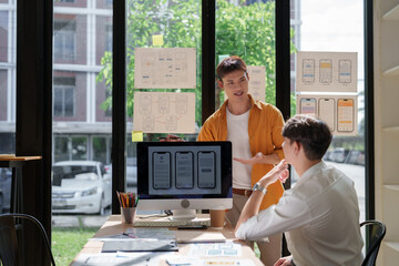 Ui designers collaborating on mobile application development