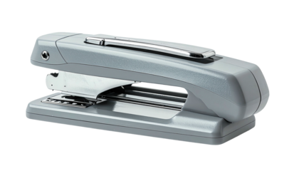 Metallic grey desktop stapler on black backdrop, office supply
