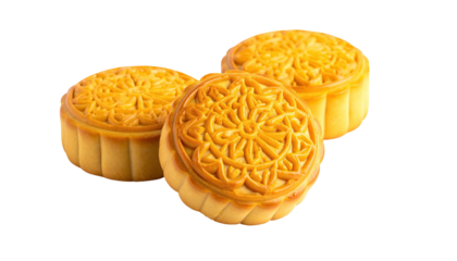 Three ornate, golden mooncakes against a solid black backdrop