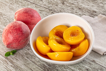 Sweet ripe yellow canned peaches