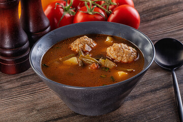 Tomato Soup with meatballs and vegetables