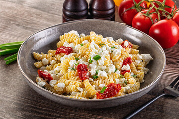 Italian pasta fusili with curd
