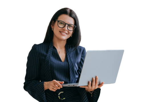 Confident American young businesswoman in suit standing on transparent background with laptop looks at camera