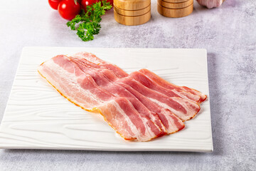 Raw bacon pork meat slices