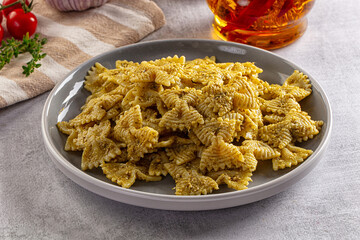 Italian green pasta farfalle with pesto