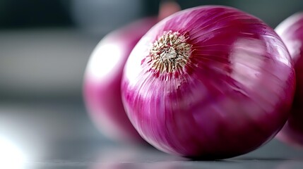 Fresh purple onions with papery skin on neutral background, showcasing vibrant color and natural texture for food photography and culinary content.