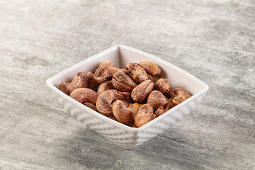 Unpeeled cashew nuts in the bowl