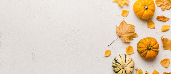 Autumn composition. Pattern made of dried leaves and other design accessories on table. Flat lay, top view