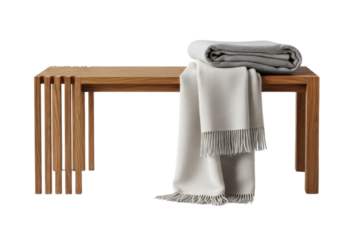 Cozy wooden bench with folded blankets and throws perfect for adding warmth and texture to any room isolated on transparent background