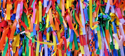 Surface covered with ribbons of fabric of all colors