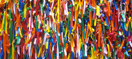 Surface covered with ribbons of fabric of all colors