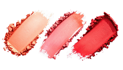 Three coral-hued powder swatches isolated on a black background