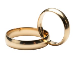 Two intertwined gold wedding rings symbolizing eternal love and commitment isolated on transparent background