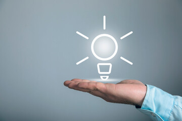 Businessman and light bulb on screen, concept idea