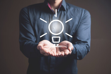 Businessman and light bulb on screen, concept idea