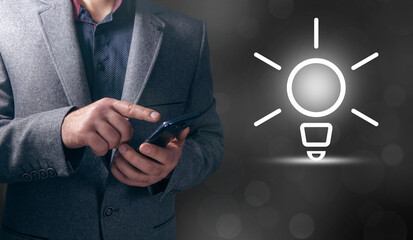 Businessman and light bulb on screen, concept idea