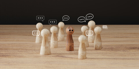 Sad wooden figure excluded from group. Concept of bullying, discrimination, isolation, loneliness, and mental health in society, workplace or school.