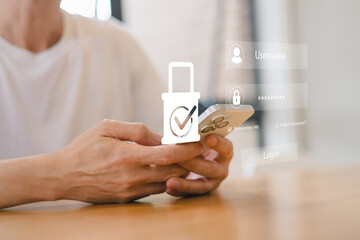 Close up of person using smartphone with digital login interface and security icon overlay, illustrating mobile cybersecurity, user authentication, data privacy, and secure access technology.