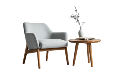 Armchair & round table with book and vase against dark background