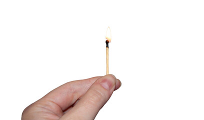 A hand holding a burning match isolated.