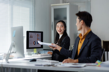 Business colleagues discussing data and exchanging documents