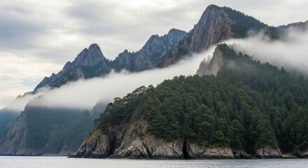 Majestic peaks and lush green forests emerge from the water, shrouded in ethereal fog