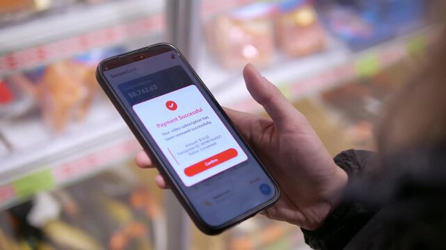 A customer in a retail store uses her phone to complete a purchase. The clip shows her tapping a secure payment link on the screen, which transitions directly to a verified transaction confirmation