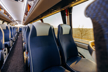 Fototapeta premium Serene train ride showcasing distant rural landscape at sunset