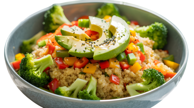 Fresh quinoa salad with avocado and colorful vegetables in a modern bowl close up on transparent background