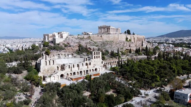 aerial shot of the Acropolis, Propylaea entrance, Parthenon, and the ancient Odeon of Herodes Atticus.