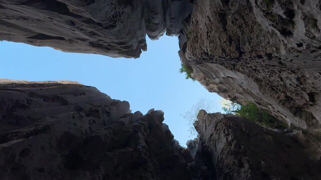 The huge holes and views that open up to the sky from the caves located in the wild geography