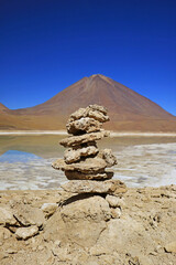 Stacked Stone Made by Traveler on the Shore of Laguna Verde or Green Lake with Licancabur Volcano in the Backdrop, Potosi, Bolivia, South America