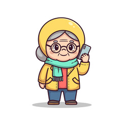 Fototapeta premium Elderly woman smiling and holding smartphone while wearing a yellow coat 