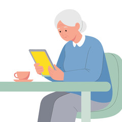 Elderly woman reading on tablet while sitting at table with coffee  