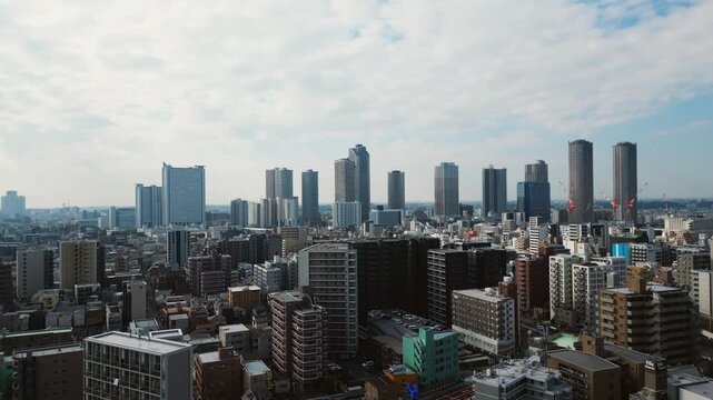 Ascending drone shot of Musashi Kosugi skyline revealing power balance