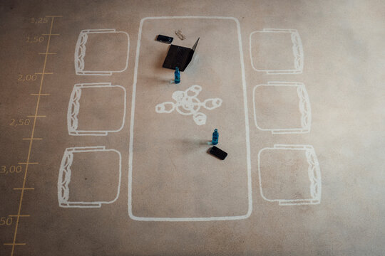 Innovative meeting room setup with floor markings and digital devices