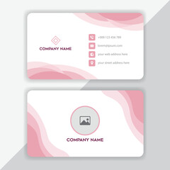 Naklejka premium Elegant and modern business card design featuring soft pink abstract wave patterns and clean typography for professional branding and identity
