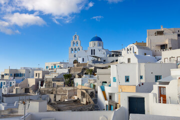Fototapeta premium Picturesque View of Houses and The Holy Church of the Transfiguration of the Savior in Pyrgos Kallistis Village, Santorini, Greece. 7 October 2025
