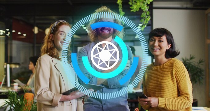 Standing team holding smartphone and tablet at open plan office, displaying digital UI overlay - Powered by Adobe