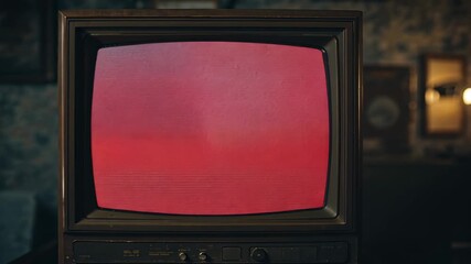 Starting pink static, vintage CRT television pulsing deep hues in retro living room, with lit lamp - Powered by Adobe