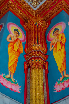Colorful Gautama Buddha wall art inside Wat Chalong temple, Phuket