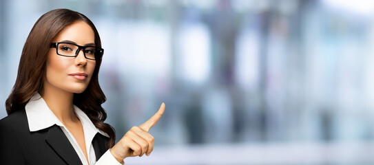 Banner wide image - confident serious businesswoman in glasses spectacles pointing finger,...