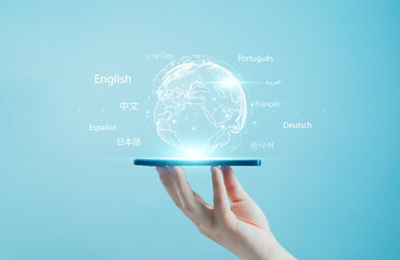 Hand holding smartphone with glowing digital globe and multilingual text, symbolizing global communication, translation technology, international connection, and language learning concept.
