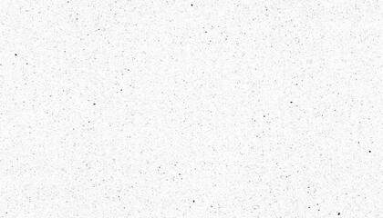 Textured white background with black speckles creates minimalist and abstract pattern